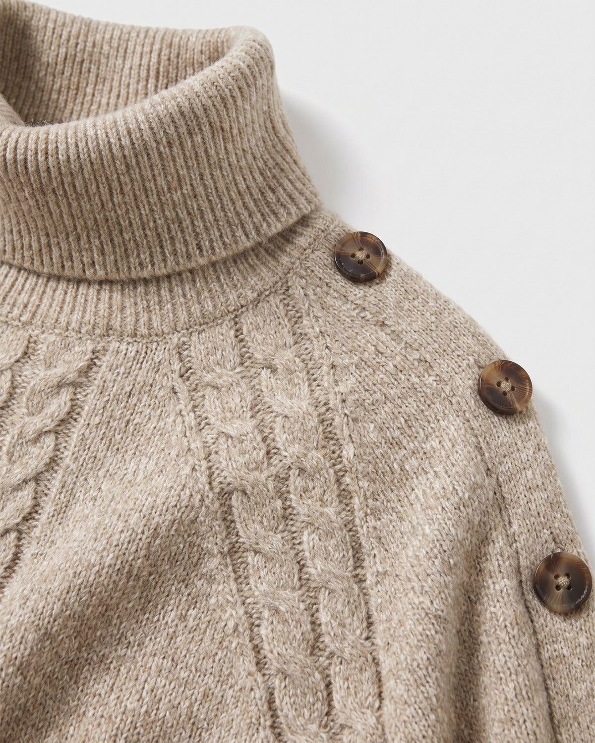 Cable Knit Turtleneck Poncho Sweater With Button Shoulders - close-up detail (Khaki Oatmeal)