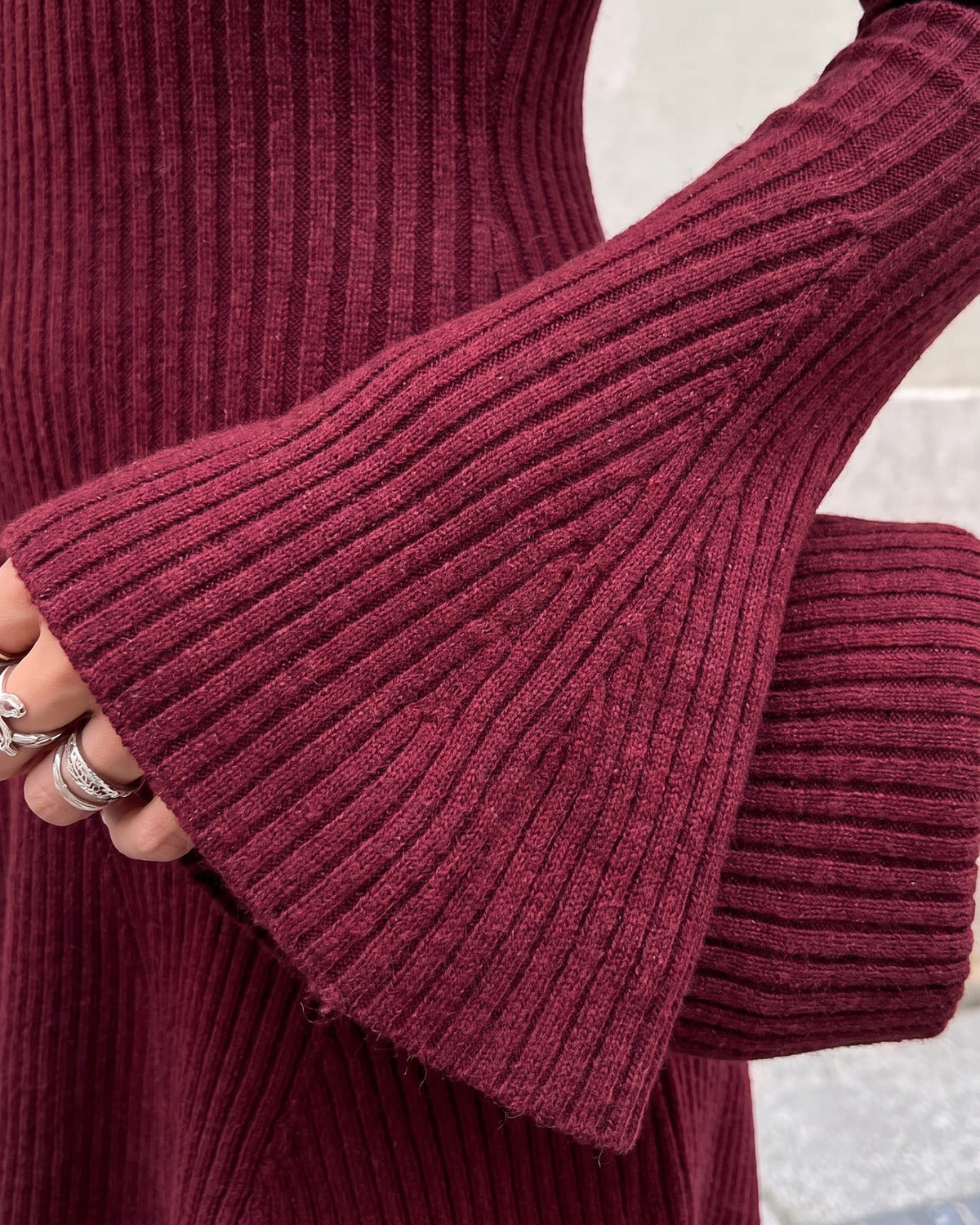 Ribbed A-Line Sweater Dress With Long Flare Sleeves - close-up detail (Burgundy)