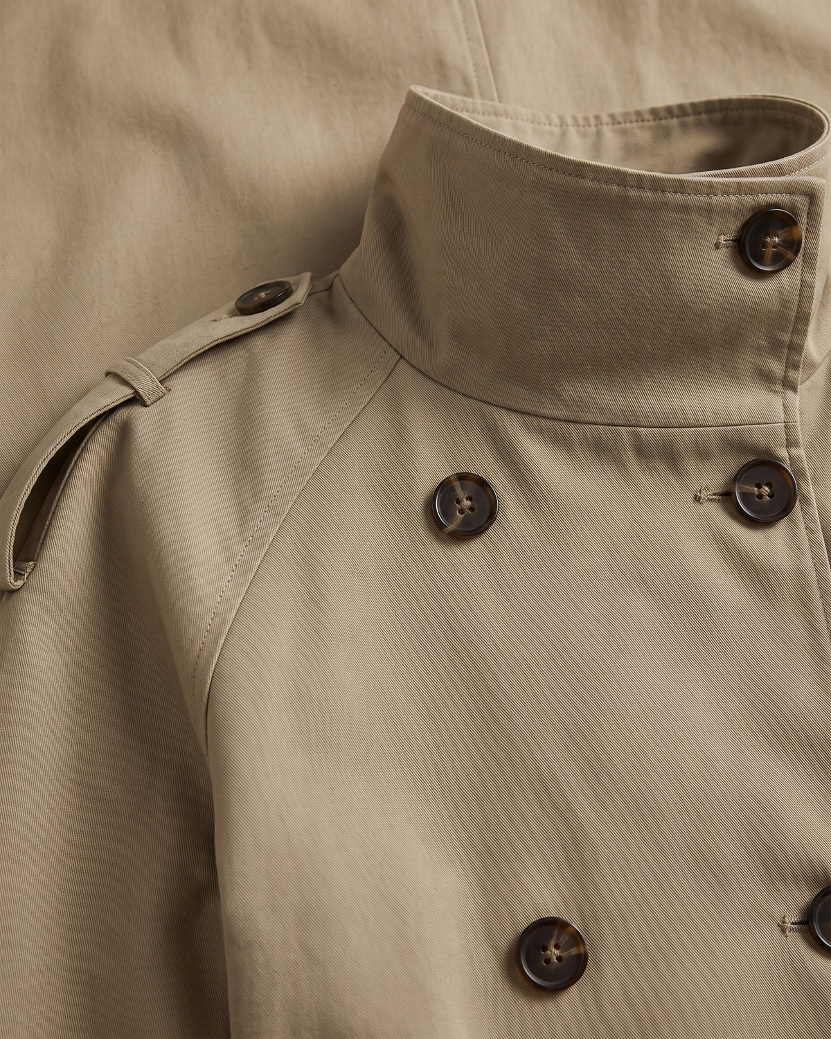 Short Double Breasted Trench Coat With Funnel Neck and Belt - close-up detail (Khaki Stone)