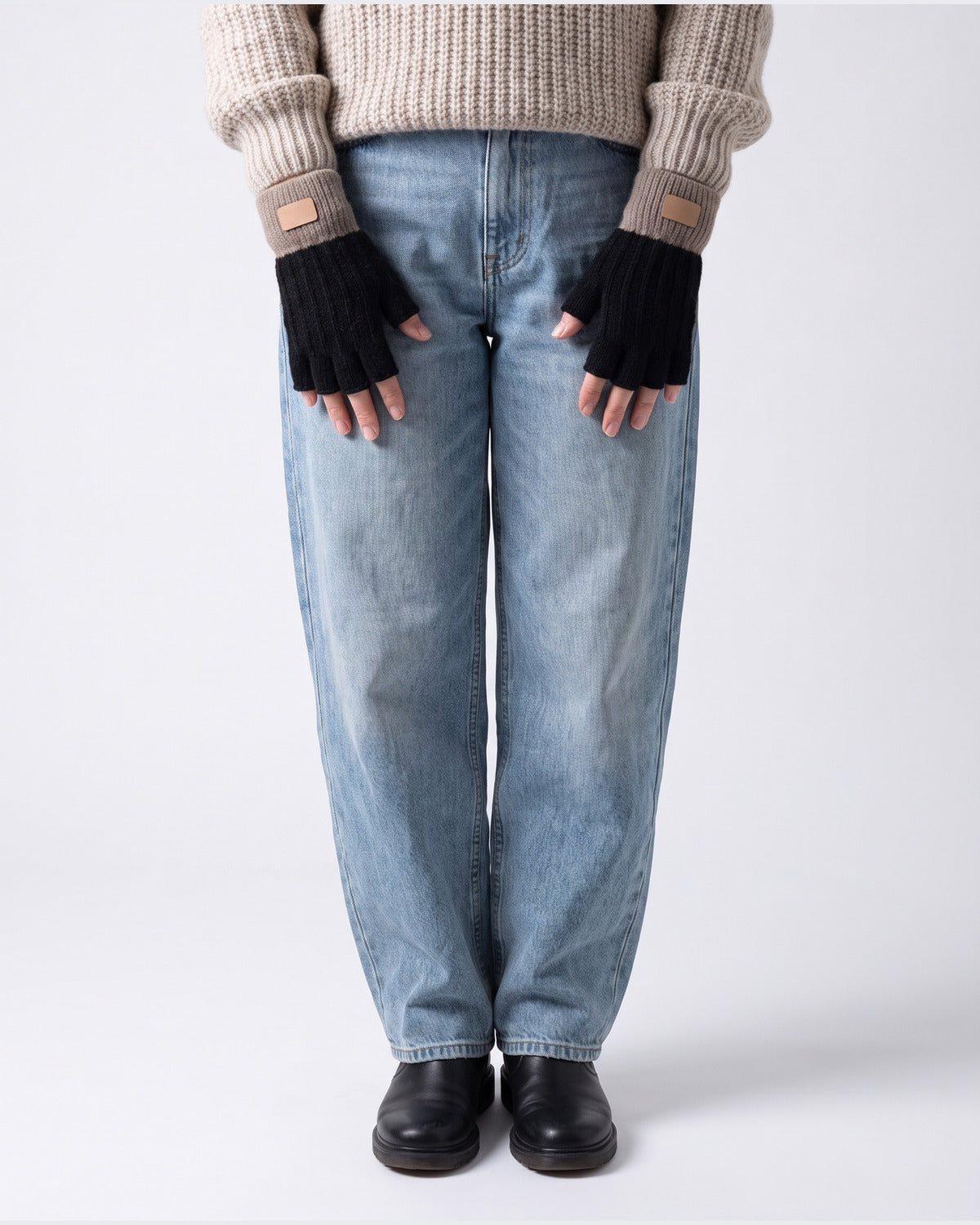 Two Tone Knit Fingerless Gloves With Ribbed Cuff - worn view (Black With Taupe Cuff)